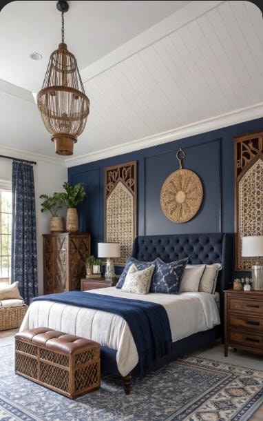 Navy coastal bedroom with rattan pendant and tufted headboard